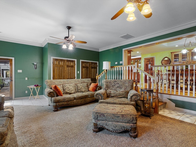 living room with crown molding, ceiling fan, and light tile patterned floors