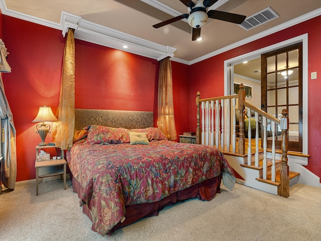 bedroom with ornamental molding, carpet floors, and ceiling fan