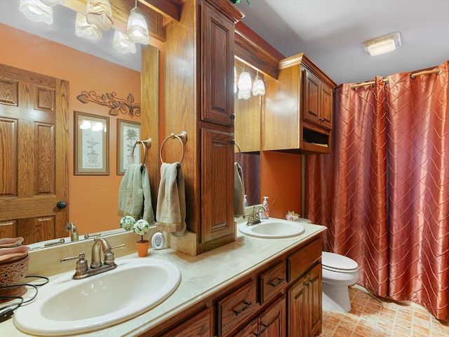 bathroom with vanity, a shower with shower curtain, and toilet