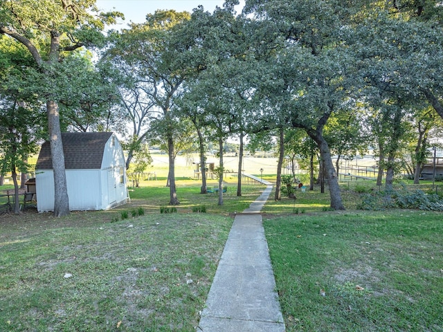 view of yard featuring a storage unit and a rural view