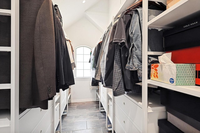 walk in closet with vaulted ceiling