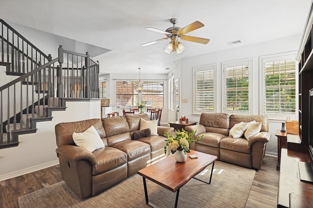 living room with ceiling fan and hardwood / wood-style floors