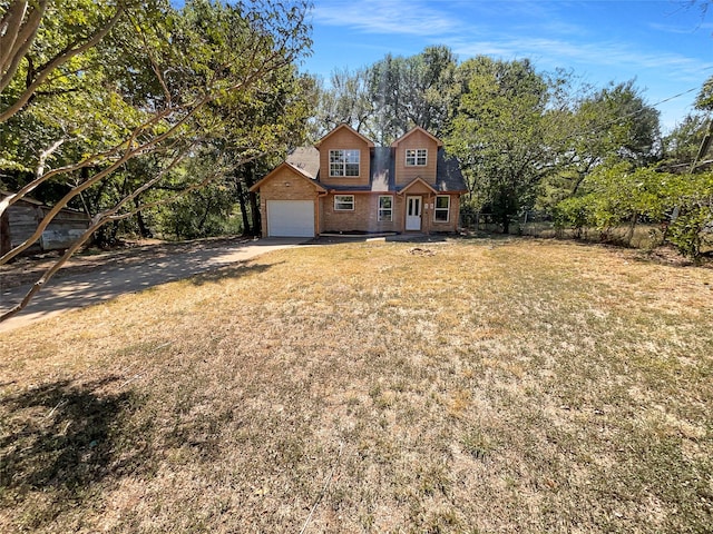 front of property featuring a garage and a front lawn