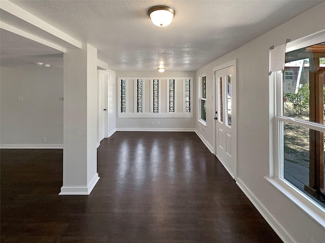 117 Avondale Ave, Azle, TX 76020 - entryway with a textured ceiling, baseboards, and a healthy amount of sunlight