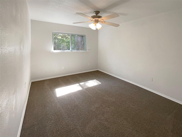 117 Avondale Ave, Azle, TX 76020 - empty room featuring dark carpet, ceiling fan, and baseboards