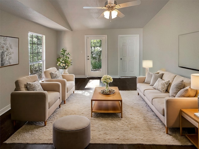 living room featuring wood-type flooring, vaulted ceiling, and ceiling fan