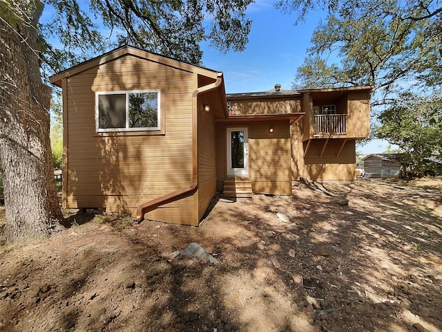 117 Avondale Ave, Azle, TX 76020 - back of house featuring entry steps and a balcony
