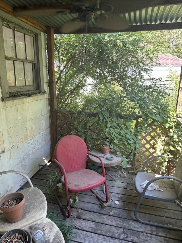 wooden deck featuring ceiling fan