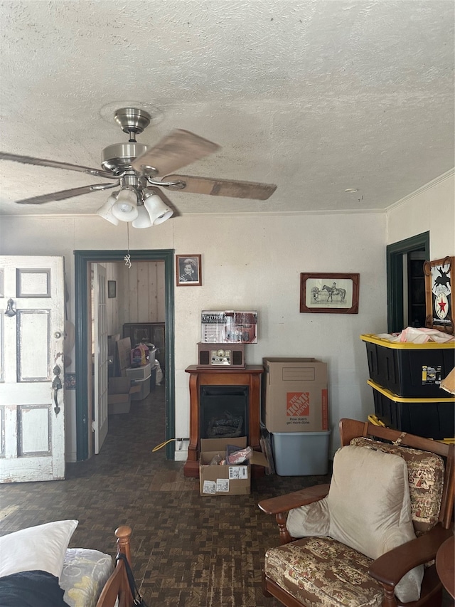 living room featuring a textured ceiling and ceiling fan