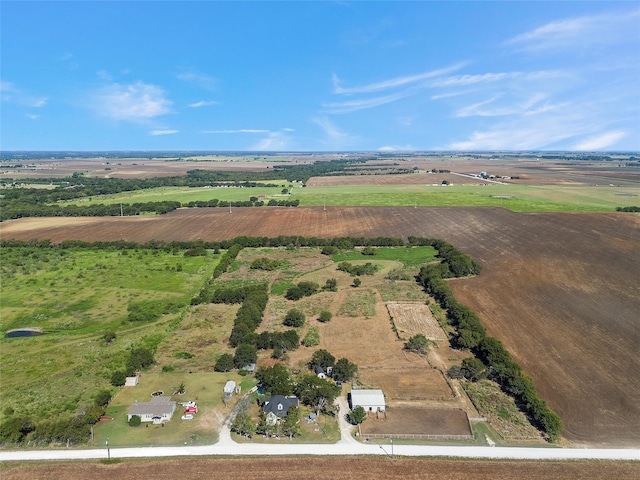 birds eye view of property with a rural view