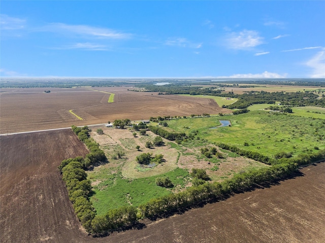 birds eye view of property featuring a rural view