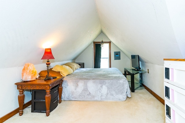 carpeted bedroom with vaulted ceiling