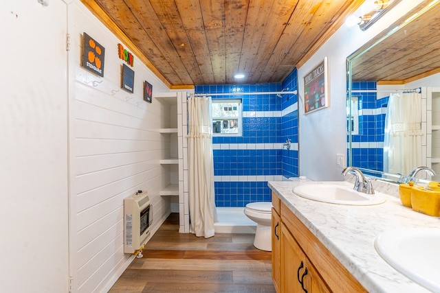 bathroom with vanity, wood-type flooring, heating unit, curtained shower, and toilet