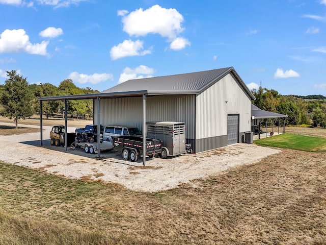 exterior space featuring an outbuilding and a carport