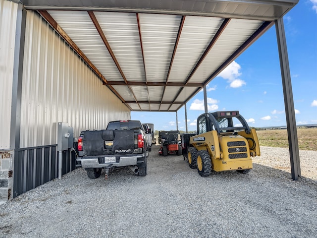 view of vehicle parking featuring a carport