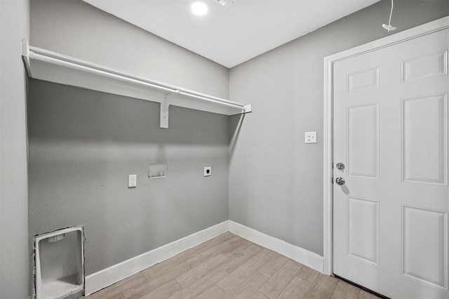 laundry area with washer hookup, electric dryer hookup, wood finished floors, laundry area, and baseboards