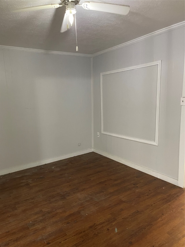 spare room featuring a textured ceiling, crown molding, dark hardwood / wood-style floors, and ceiling fan