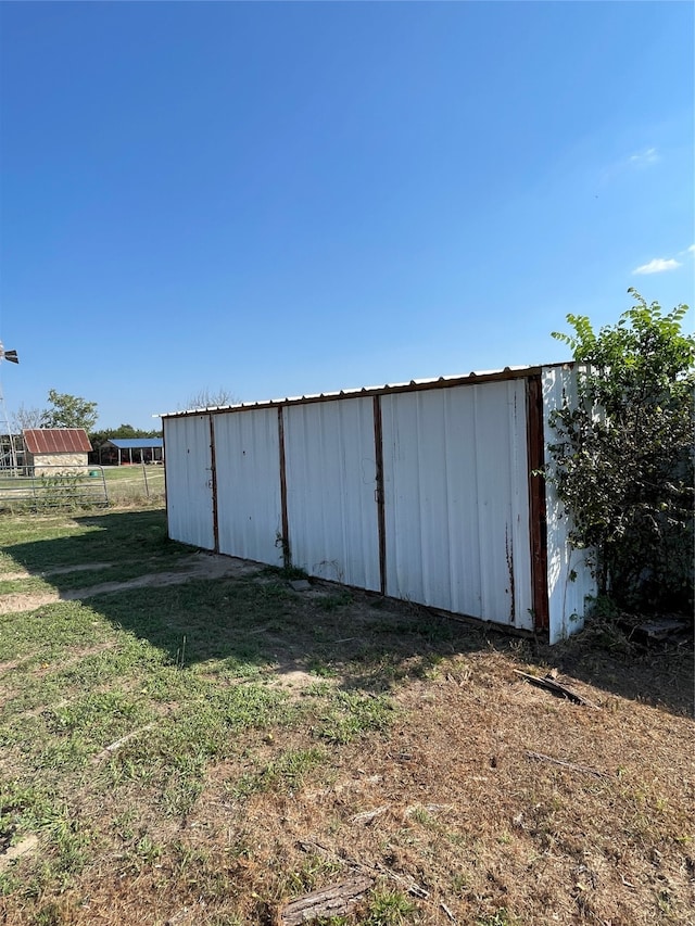 view of outdoor structure with a yard