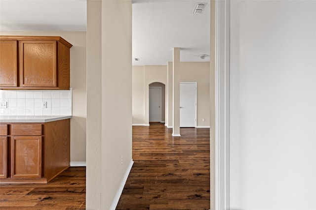 1108 E E Park, Lindale, TX 75771 - hall with dark wood finished floors, arched walkways, and baseboards
