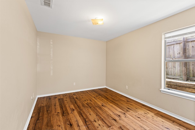 spare room featuring light hardwood / wood-style floors