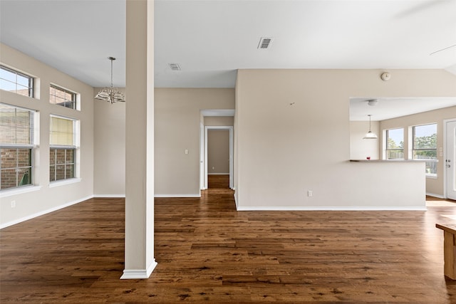 1108 E E Park, Lindale, TX 75771 - unfurnished living room featuring dark wood-style flooring, baseboards, and a chandelier
