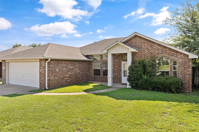 view of front facade with a garage and a front lawn