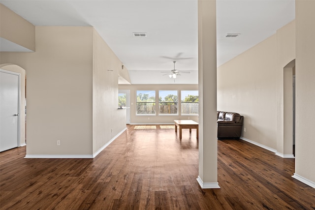 interior space with ceiling fan and dark wood-type flooring