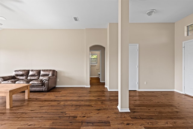 1108 E E Park, Lindale, TX 75771 - living area with arched walkways, dark wood-type flooring, and baseboards