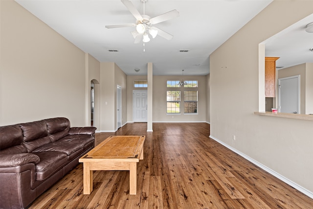 living room with hardwood / wood-style flooring and ceiling fan