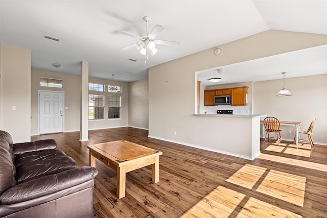 1108 E E Park, Lindale, TX 75771 - living room with a ceiling fan, wood finished floors, baseboards, and lofted ceiling
