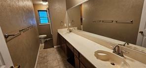 149 NW Suzanne Ter, Burleson, TX 76028 - bathroom featuring double vanity and toilet