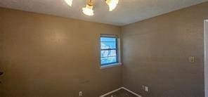 149 NW Suzanne Ter, Burleson, TX 76028 - unfurnished room with baseboards