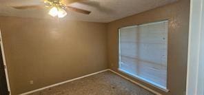 149 NW Suzanne Ter, Burleson, TX 76028 - unfurnished room with a ceiling fan, baseboards, and carpet flooring