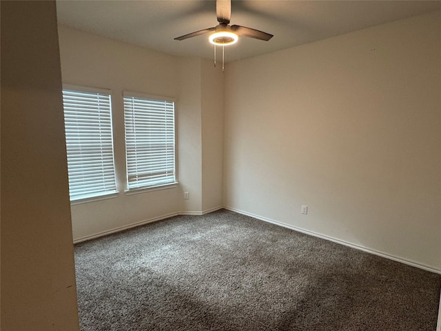 empty room featuring carpet floors and ceiling fan