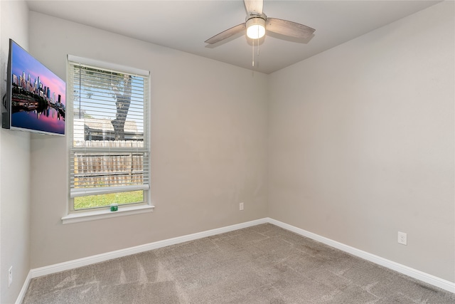 unfurnished room featuring carpet floors and ceiling fan