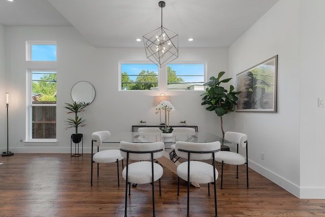 dining area with a notable chandelier, dark hardwood / wood-style floors, and a wealth of natural light