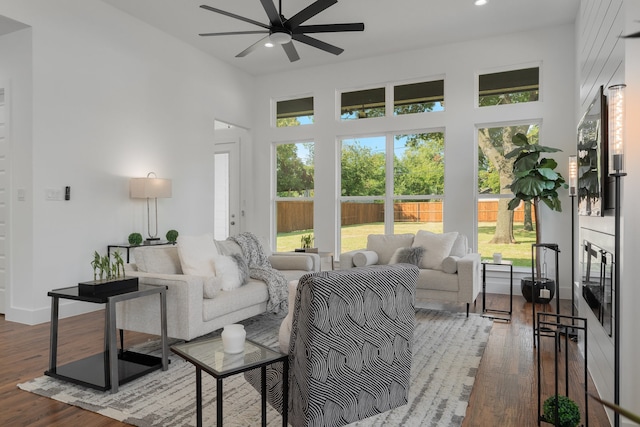 sunroom / solarium featuring ceiling fan and a wealth of natural light