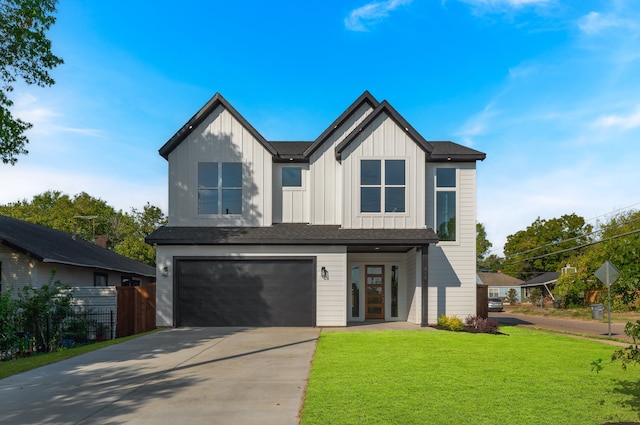 view of front facade featuring a garage and a front lawn