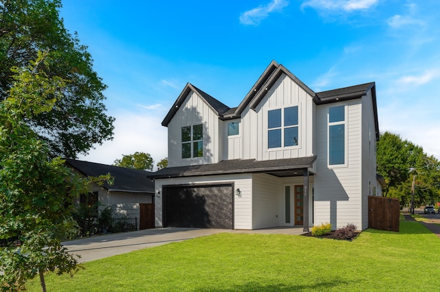 view of front of property with a front lawn and a garage