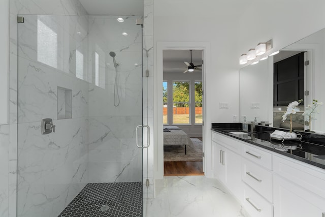 bathroom with ceiling fan, vanity, and an enclosed shower