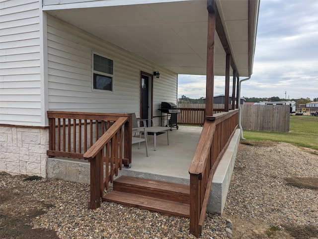 wooden deck featuring area for grilling