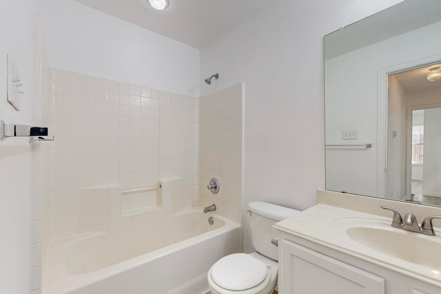 full bathroom featuring vanity, bathing tub / shower combination, and toilet