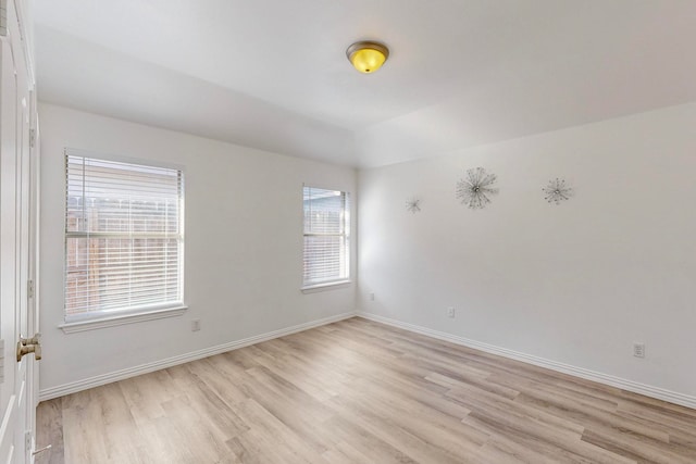 spare room with light hardwood / wood-style floors