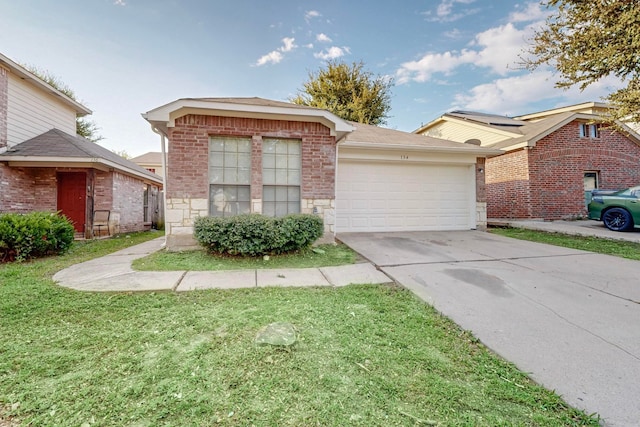 view of front facade with a garage and a front lawn