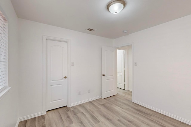 unfurnished bedroom featuring light wood-type flooring