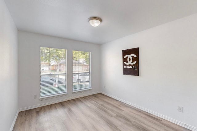 spare room featuring light hardwood / wood-style flooring