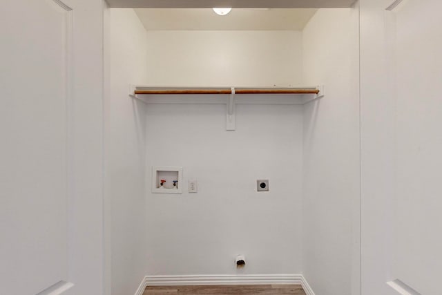 laundry room featuring hookup for an electric dryer, hardwood / wood-style flooring, and hookup for a washing machine