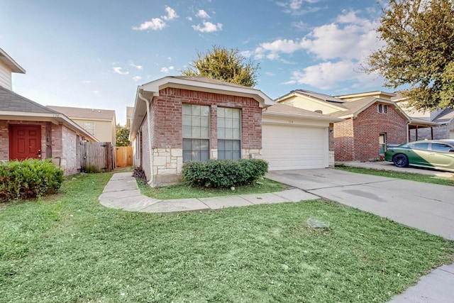 view of front of property with a garage and a front yard