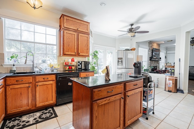 kitchen featuring crown molding, black dishwasher, stainless steel fridge, and a kitchen island