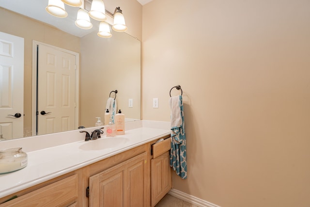 bathroom featuring vanity and a chandelier